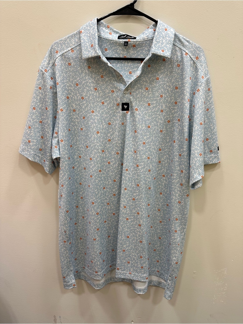Bad Birdie Light Blue Polo with Orange Accent Print